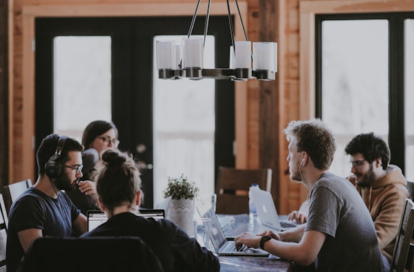 Advisors reviewing a quote side by side at an office table